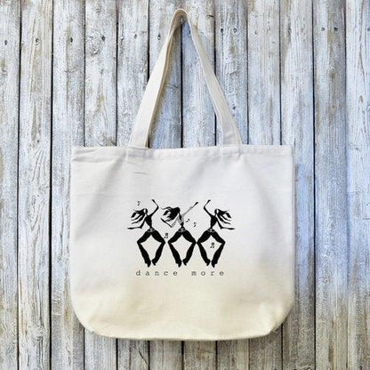 Organic Dance Tote Bag with black artist design of dancers and 'dance more' text. Eco-friendly canvas bag ideal for dance gear or daily use.