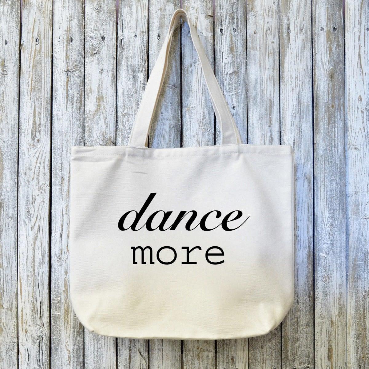 Dance Lover Canvas Tote Bag - Organic | Sustainable Gift with 'dance more' text in black on natural cotton. Eco-friendly and artist-designed for dancers.