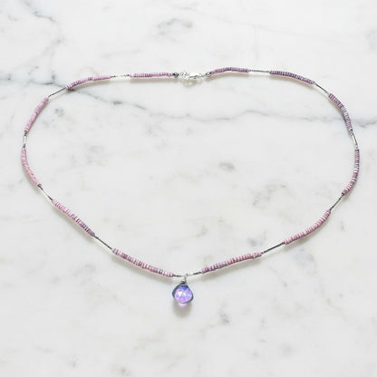 Pink and purple beaded jewelry with gemstone pendant