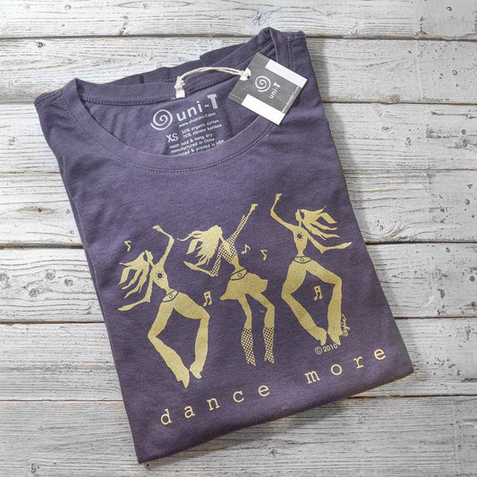 Folded Women's Dance More Long Sleeve T-Shirt in bamboo and organic cotton with gold dancing figures graphic by Uni-T, ideal for dancers.