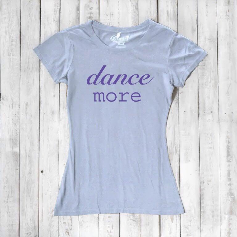 Light blue Women's Dance T-Shirt in bamboo & organic cotton with purple 'dance more' text. Soft, eco-friendly top for dance and fitness fans.
