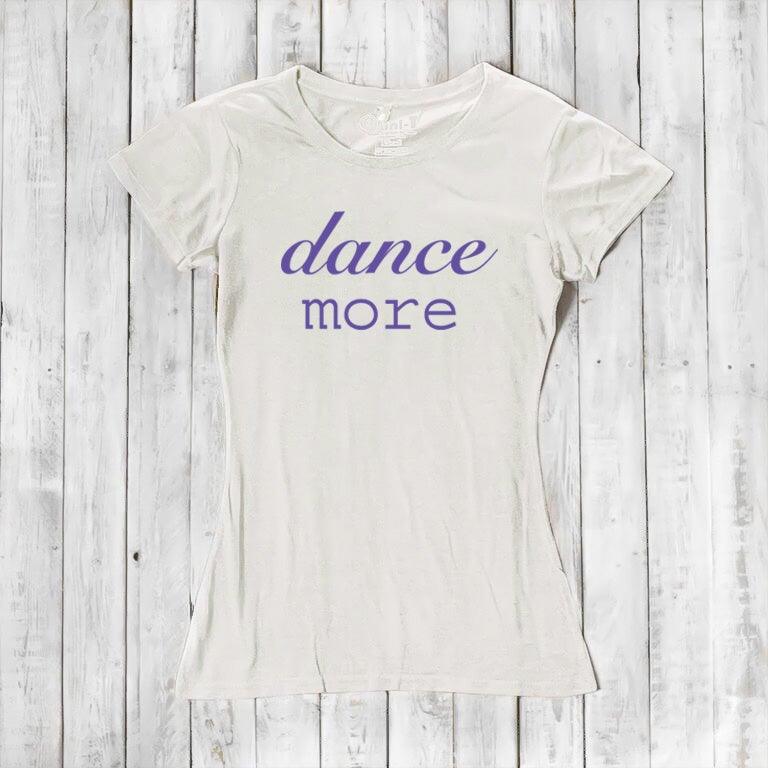 Cream Women's Dance T-Shirt made of bamboo & organic cotton with purple 'dance more' graphic. Sustainable and uplifting tee for dancers.