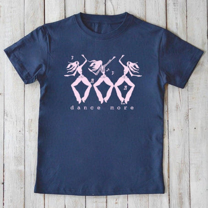 Navy blue kids' organic cotton t-shirt with pink 'dance more' graphic, sustainable top for active, playful lifestyles.