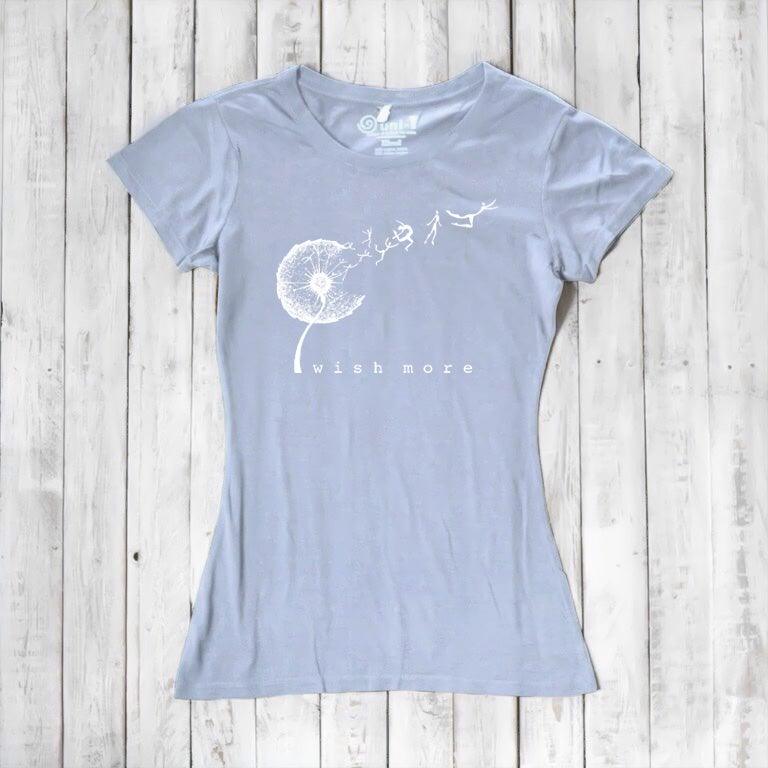 Light blue Women's Bamboo & Organic Cotton T-Shirt with white 'Wish More' dandelion graphic. Motivational and sustainable tee by Uni-T.