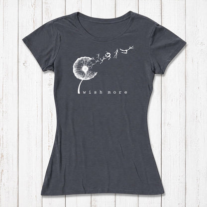 Navy blue women's graphic T-shirt with a white dandelion and flying seed design, featuring the phrase 'wish more' in lowercase letters, casual style