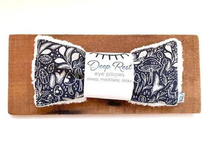 Deep Rest Eye Pillow - Forest Forage displayed on wooden board, highlighting its plush fabric and natural stress-relief benefits.