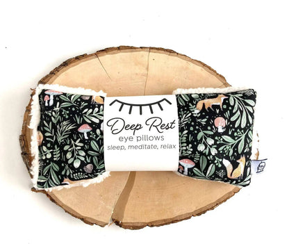 Fox & Toadstool Deep Rest Eye Pillow on wooden slab, featuring calming woodland design for stress relief and relaxation therapy.