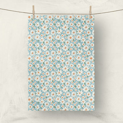 Daisy print fabric tea towel hanging on clothesline for home decor