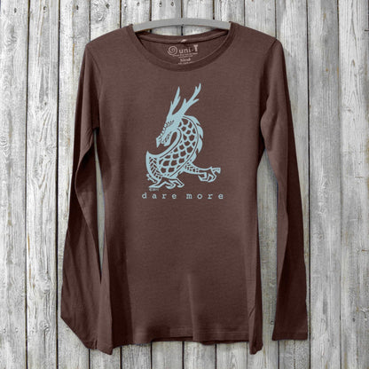 Women's Dragon Long Sleeve T-Shirt in bamboo and organic cotton, brown color with light blue dragon graphic and 'Dare More' text. Cozy fantasy art tee.
