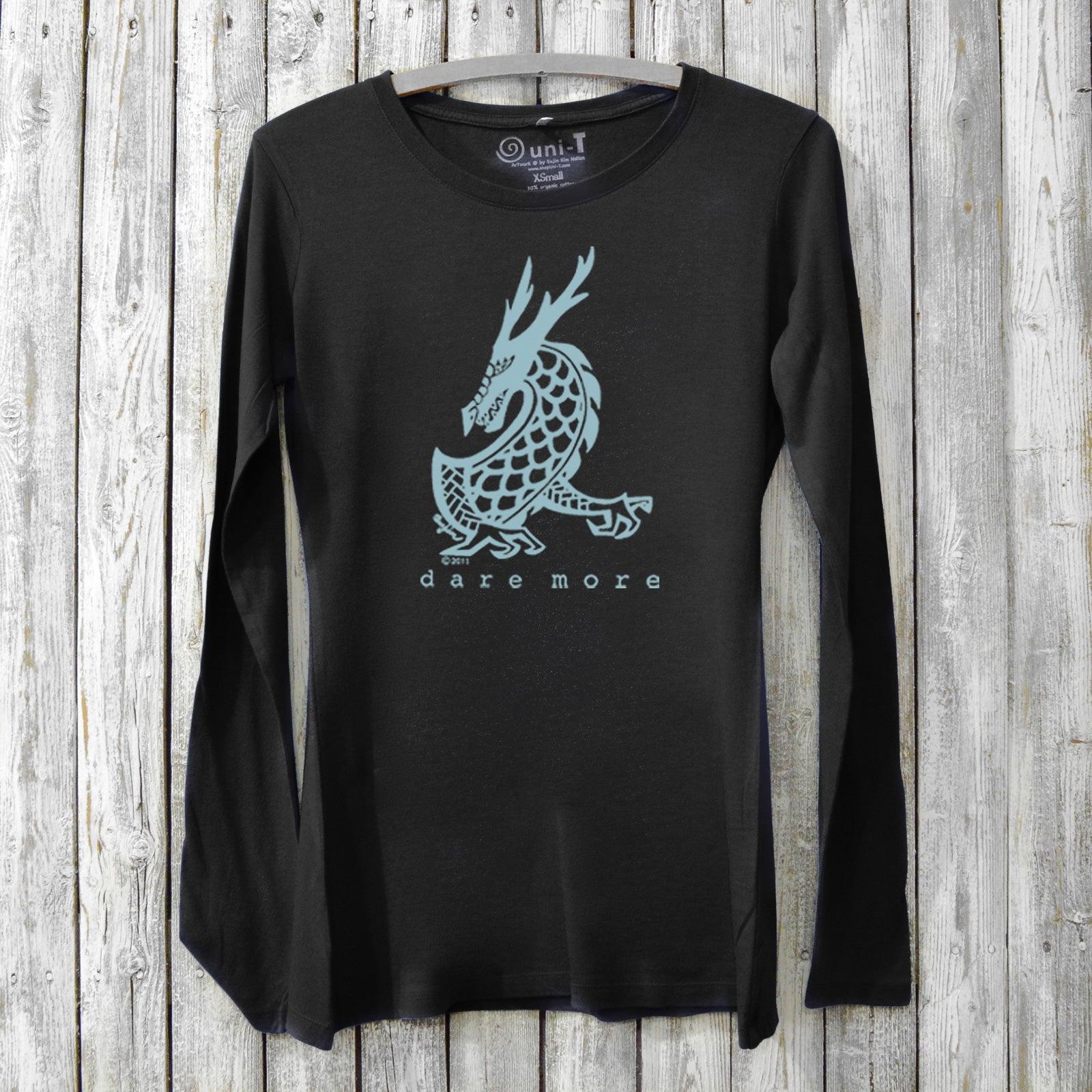 Black bamboo and organic cotton women's long sleeve T-shirt featuring a light blue dragon and 'Dare More' text. Eco-friendly adventure gift top.