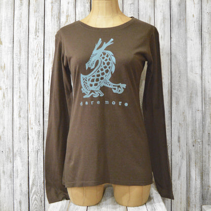 Brown 'Dare More' dragon long sleeve T-shirt for women displayed on mannequin. Bamboo and organic cotton blend with fantasy art design.