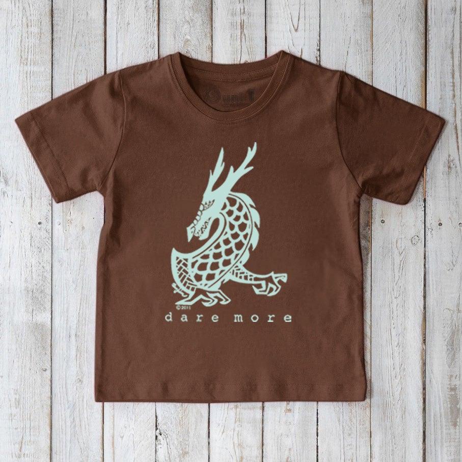 Brown Kids' Organic Cotton T-Shirt with light blue dragon artwork and 'dare more' message. Sustainable fantasy graphic tee by Uni-T.