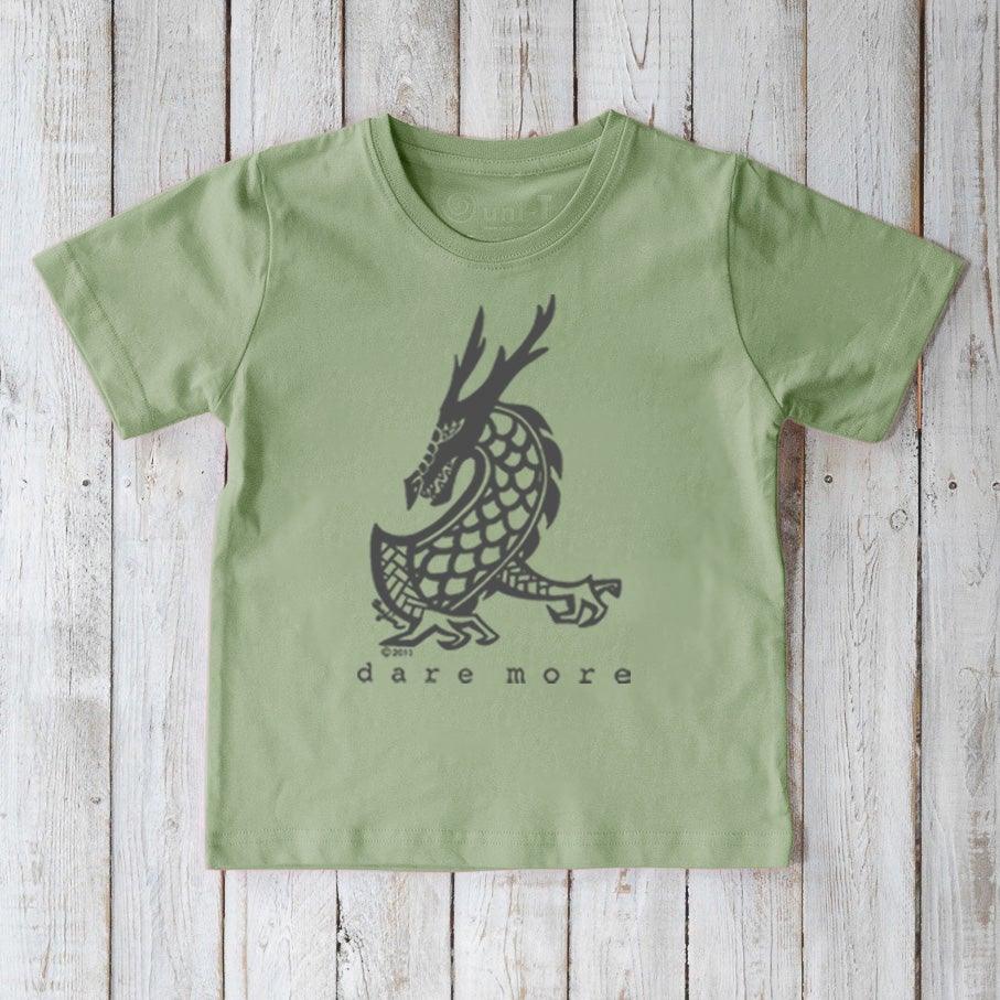 Light green Kids' Organic Cotton T-Shirt with dark dragon graphic and 'dare more' text. Eco-friendly mythical creature tee by Uni-T.