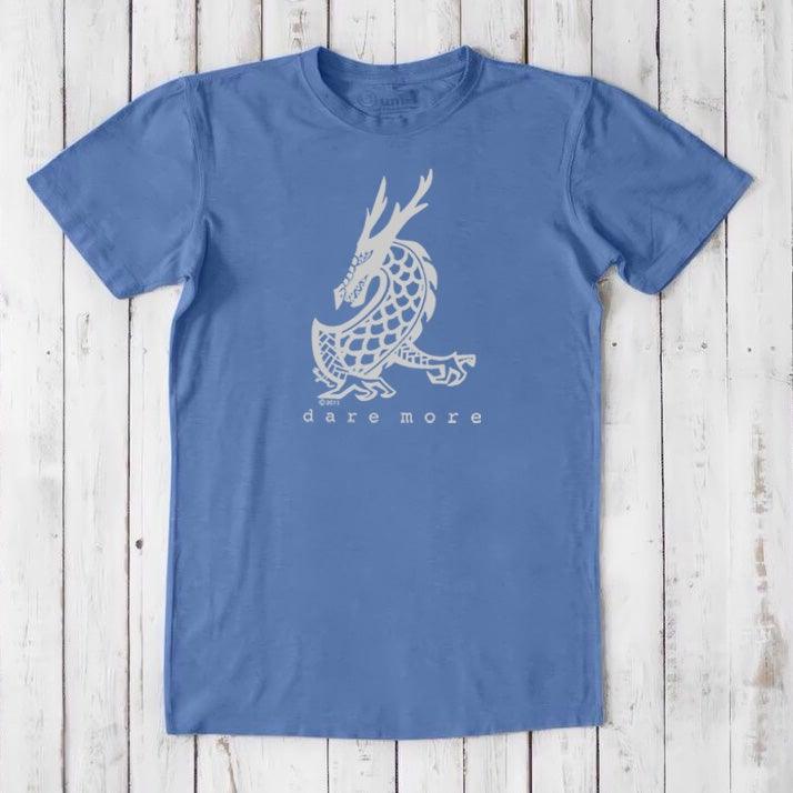 Sky blue men's organic cotton and bamboo t-shirt with white dragon graphic and 'Dare More' text, soft fantasy adventure tee for him.