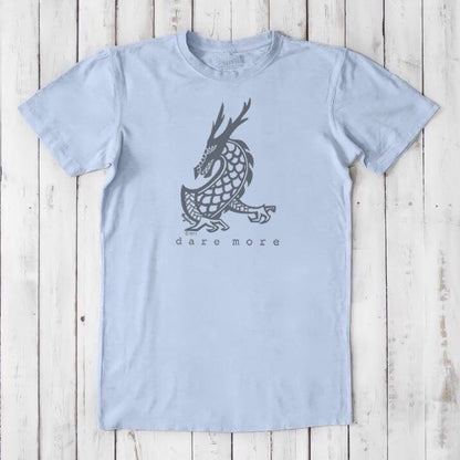 Light blue men's dragon t-shirt in bamboo and organic cotton with grey dragon artwork and 'Dare More' slogan, sustainable fantasy tee.
