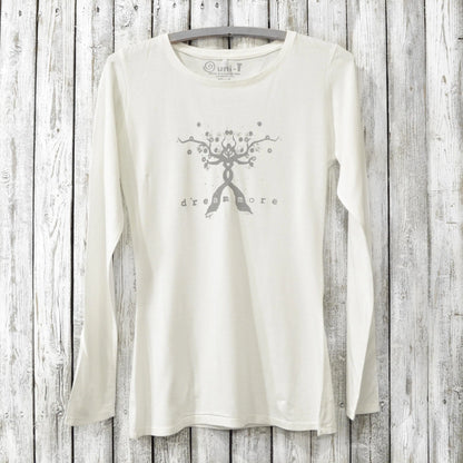 White long sleeve inspirational tee for women with 'Dream More' tree design, made from bamboo and organic cotton for cozy comfort.