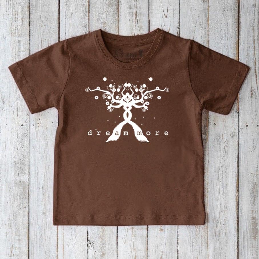 Brown Kids' Organic Cotton T-Shirt featuring white 'Dream More' uplifting graphic. Sustainable motivational shirt for children by Uni-T.