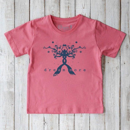Pink Kids' Organic Cotton T-Shirt with blue 'Dream More' inspirational graphic. Eco-friendly and uplifting tee by Uni-T for young dreamers.