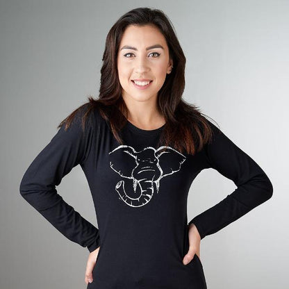 Woman wearing Women's Elephant Long Sleeve T-Shirt in Bamboo & Organic Cotton by Uni-T, featuring a white elephant graphic symbolizing strength and wisdom.