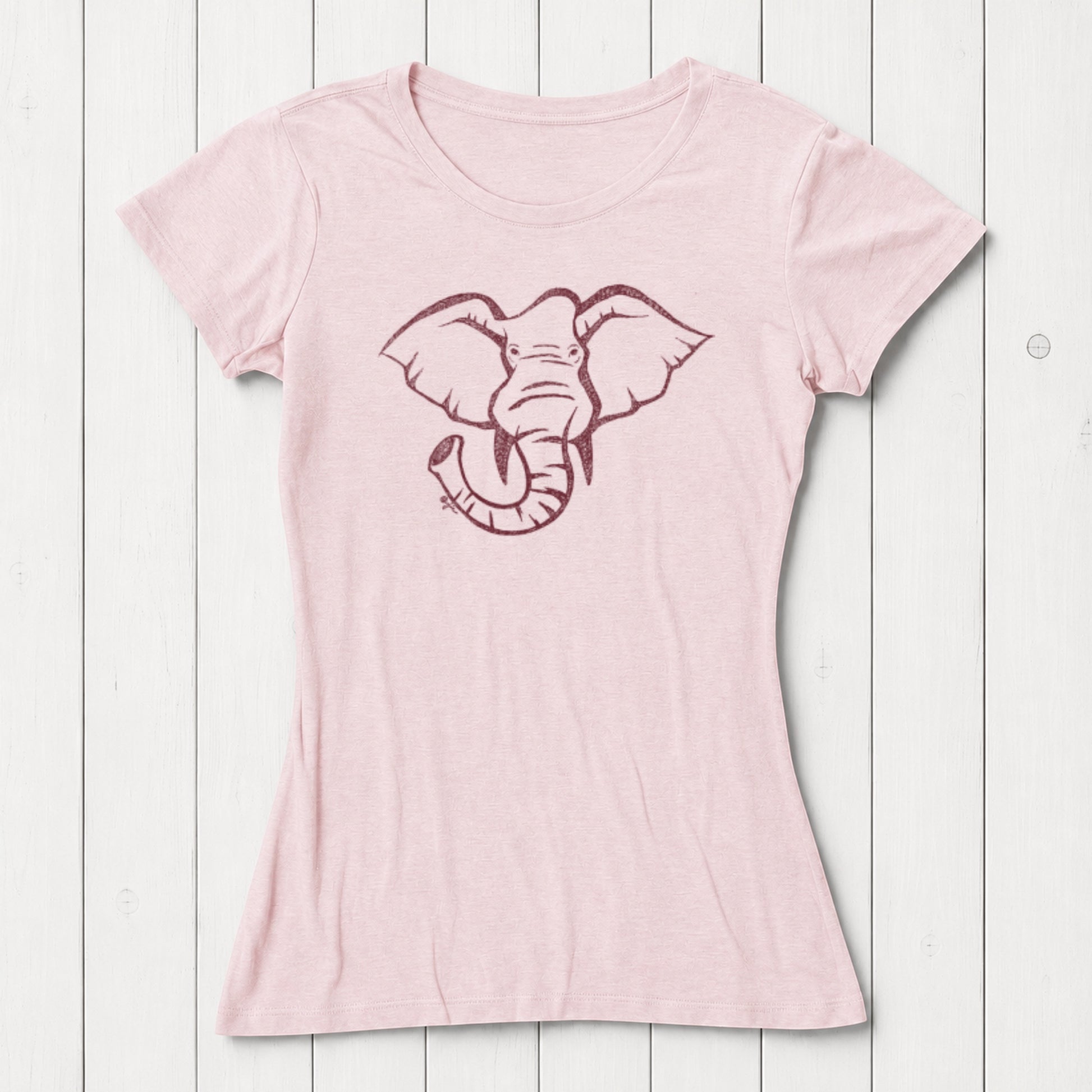 Light pink women's T-shirt made from bamboo and organic cotton with a black line art elephant graphic on the front, casual wear