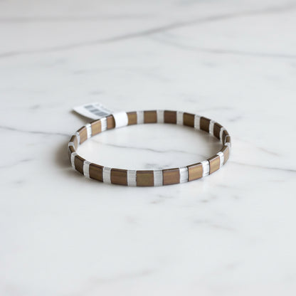 Back view of Flat Tile Bead Stretch Bracelet with tag
