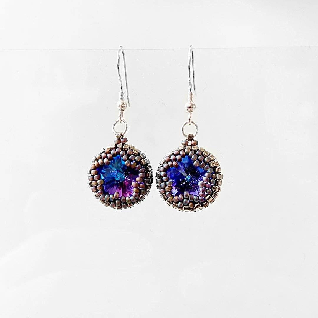 Pair of beaded crystal earrings with vibrant blue Austrian crystals, designed to complement the matching necklace.