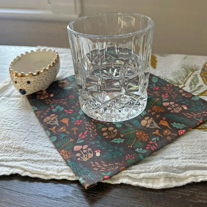 Fabric cocktail napkin with fall mushroom pattern