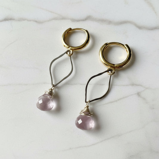 Gold and silver hoop earrings with pink gemstone teardrops