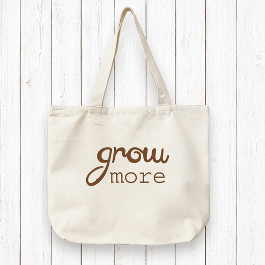 Gardening Gift Organic Tote Bag with 'grow more' text in black on eco-friendly canvas. Ideal sustainable gift for gardeners and nature lovers.
