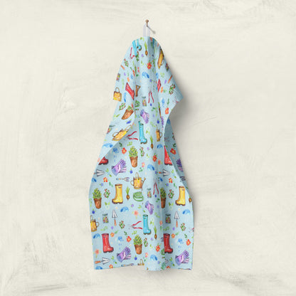 Garden Soul Tea Towel hanging on wall with gardening pattern