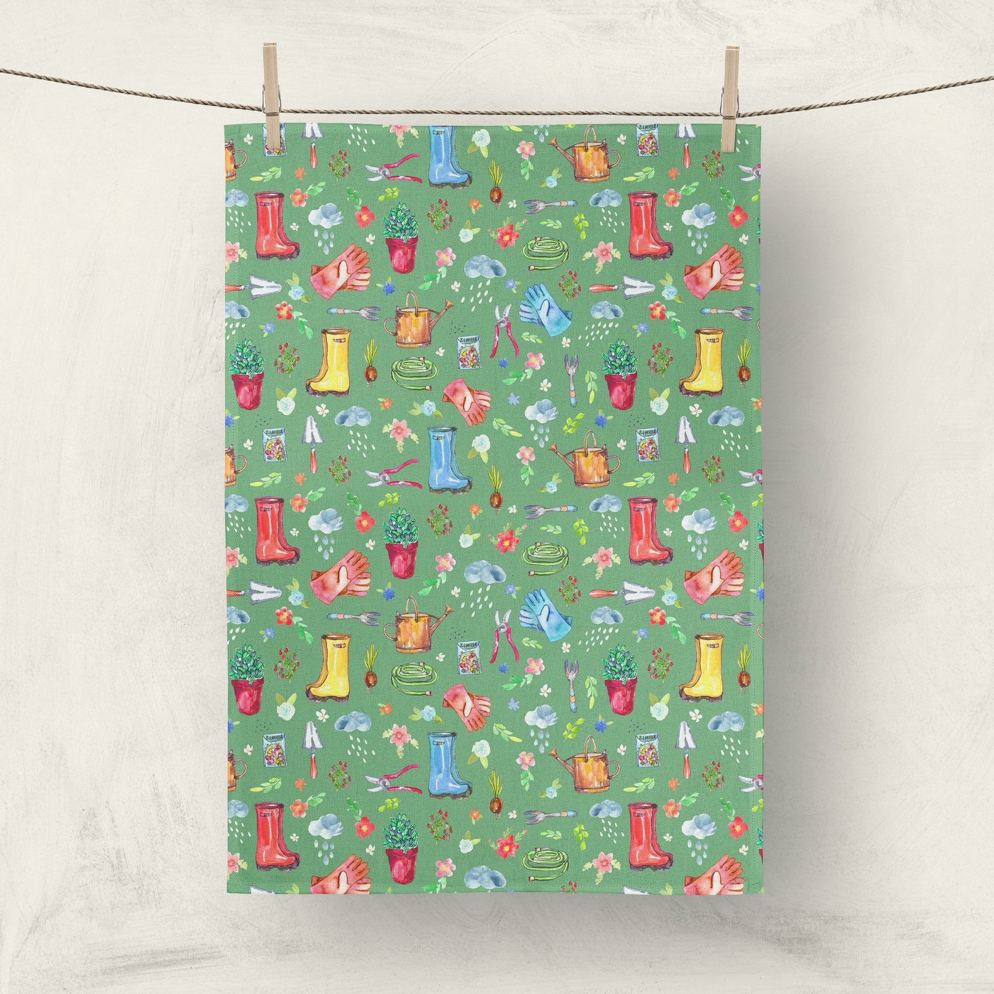 Garden Soul Tea Towel with gardening tools and plants on flowers