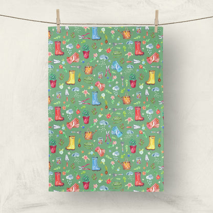 Garden Soul Tea Towel with gardening tools and plants on flowers