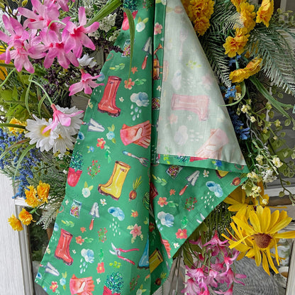 Garden Soul Tea Towel with gardening tools and plants on flowers