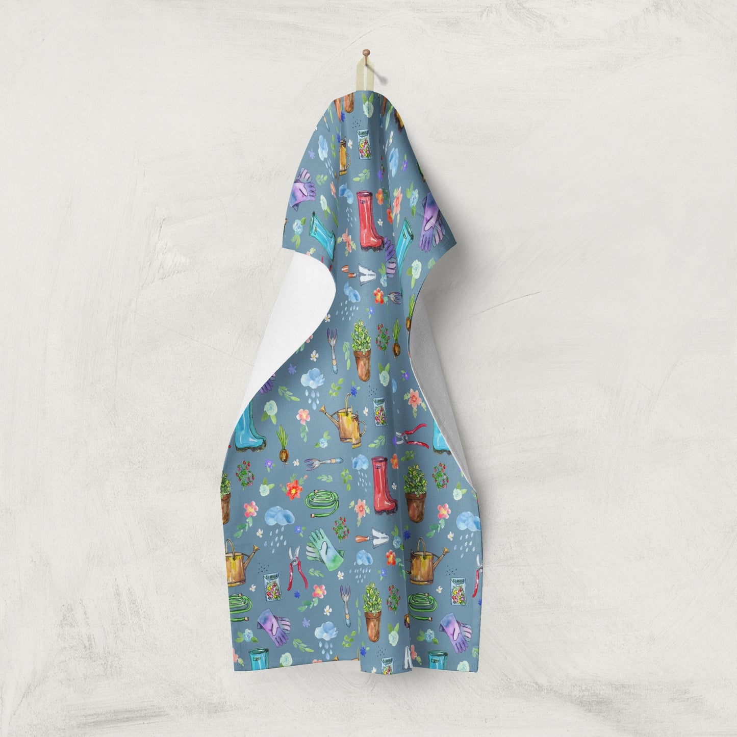 Garden Soul Tea Towel displayed on a clothesline with gardening design