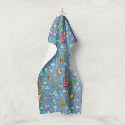 Garden Soul Tea Towel displayed on a clothesline with gardening design