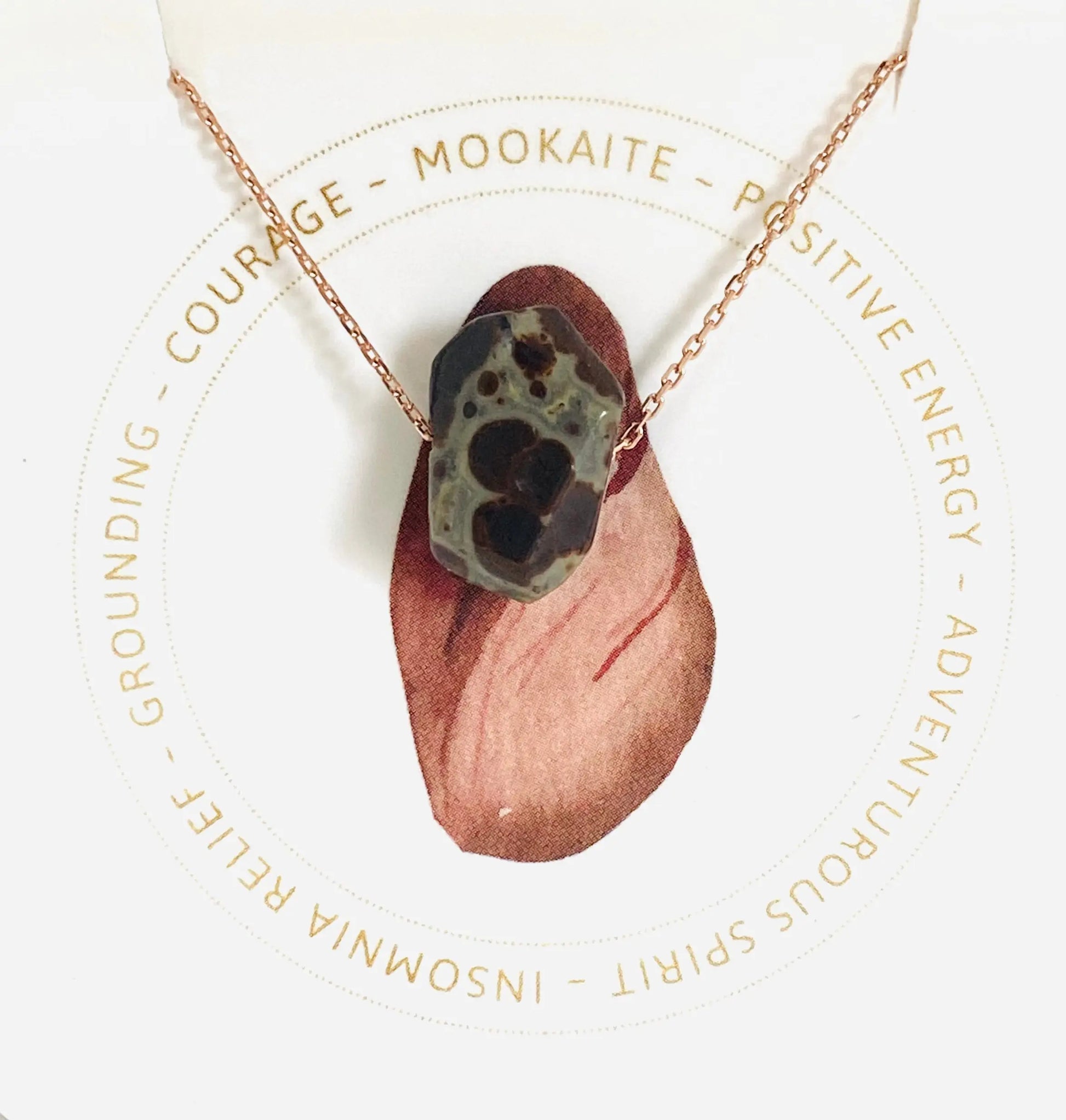 Mookaite gemstone necklace with earthy tones on rose gold chain, promoting courage and adventurous spirit.