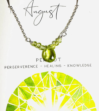 August birthstone necklace with peridot crystal beads and teardrop pendant, symbolizing healing and perseverance.