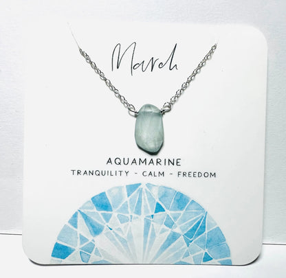 March birthstone necklace with aquamarine stone on silver chain, promoting calm and freedom.