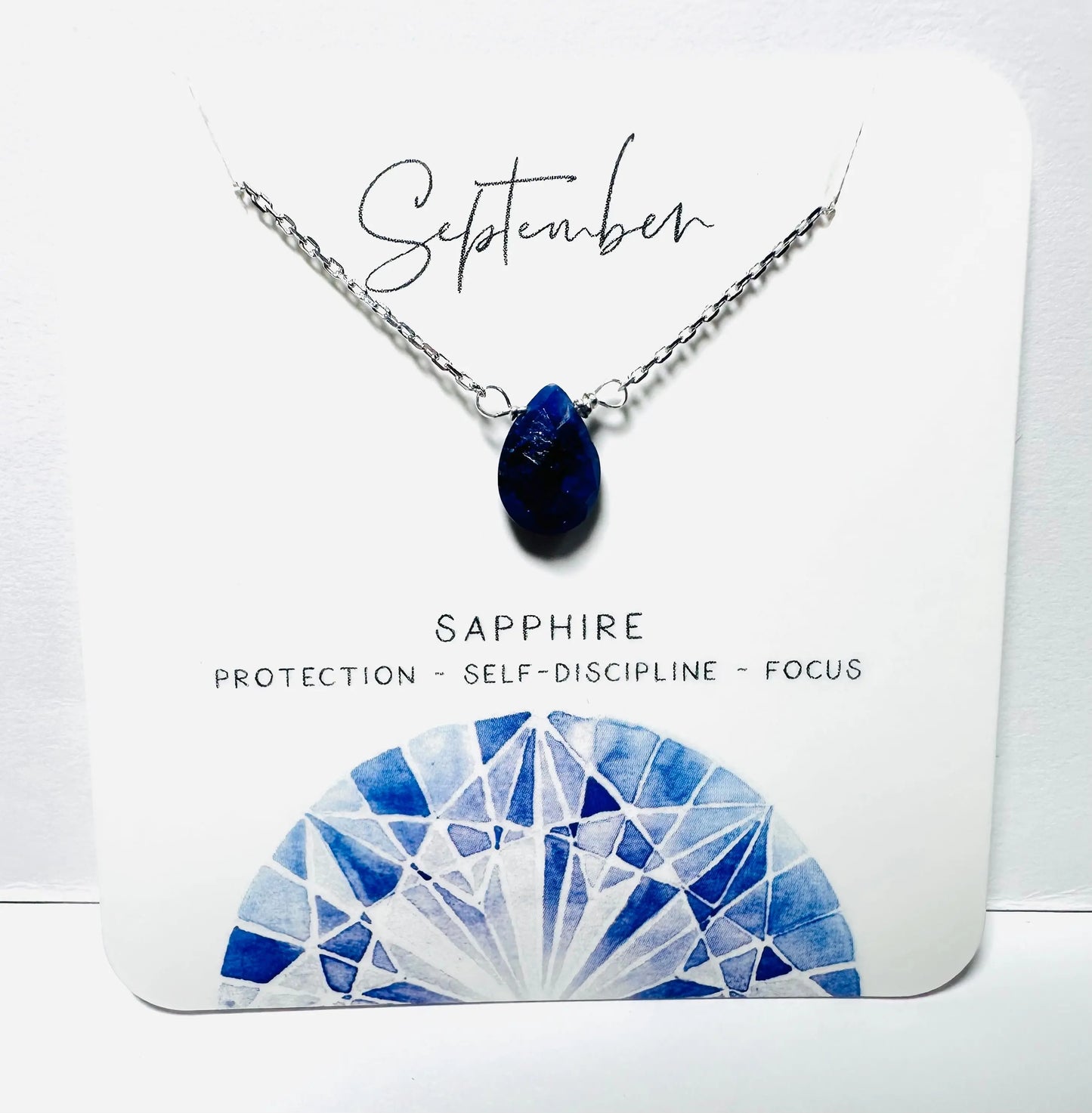 September birthstone necklace with sapphire teardrop pendant on silver chain, handmade for focus and protection.