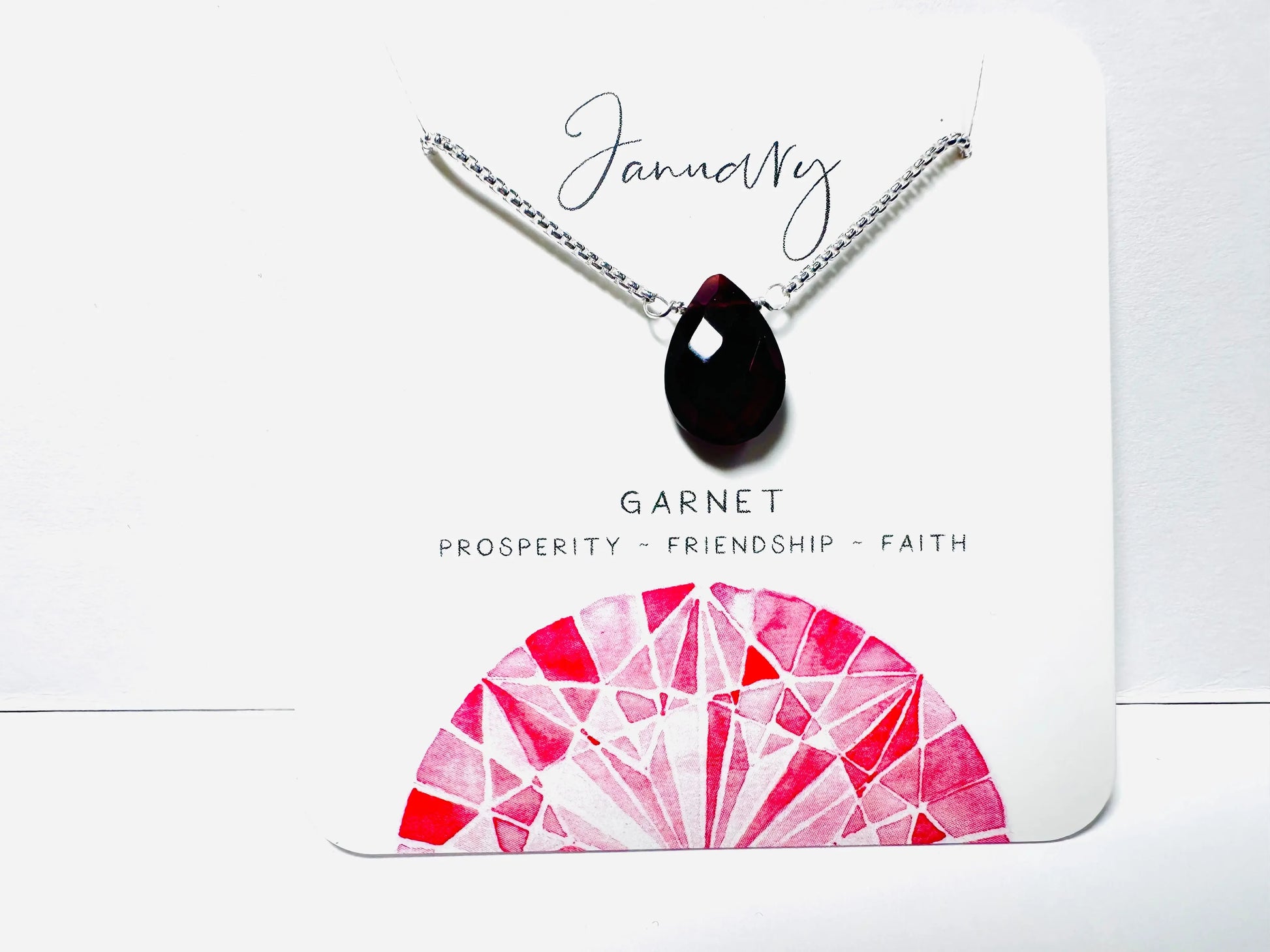 January birthstone necklace with garnet teardrop pendant on silver chain, symbolizing prosperity and friendship.
