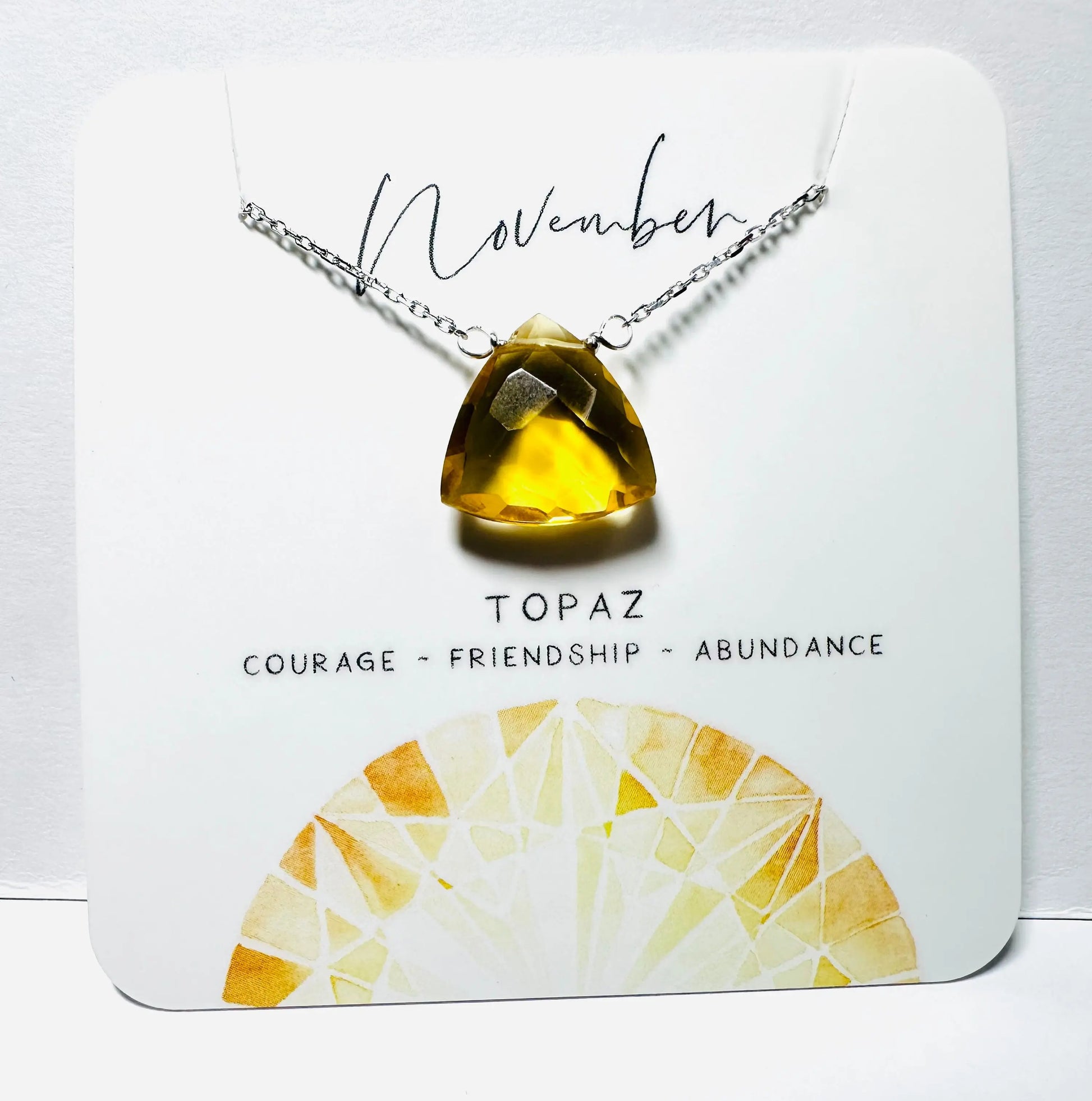 November birthstone necklace with faceted topaz pendant on silver chain, handmade for abundance and friendship.