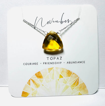 November birthstone necklace with faceted topaz pendant on silver chain, handmade for abundance and friendship.