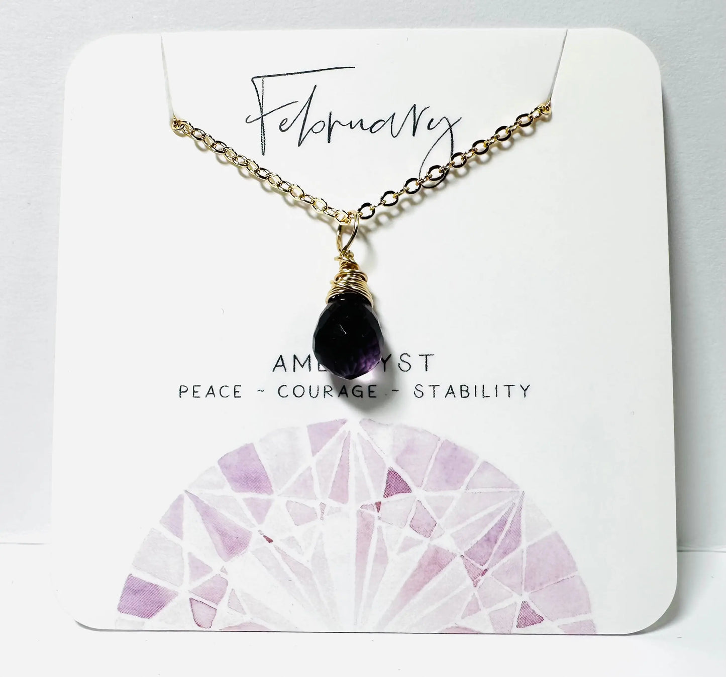 February birthstone necklace with amethyst teardrop pendant on gold chain, symbolizing peace and stability.