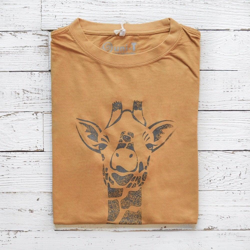 Men's Giraffe T-Shirt in bamboo & organic cotton, folded in mustard yellow with safari wildlife graphic and 'Stand Tall' theme.