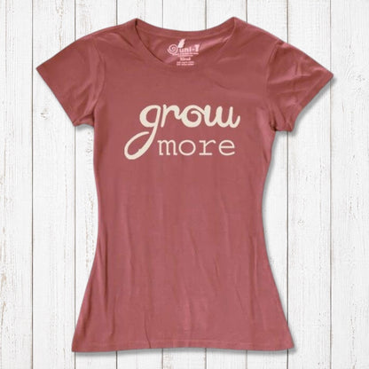 Terracotta red women's graphic tee with 'Grow More' quote in cream. Made from bamboo and organic cotton, ideal for eco-conscious gardeners.
