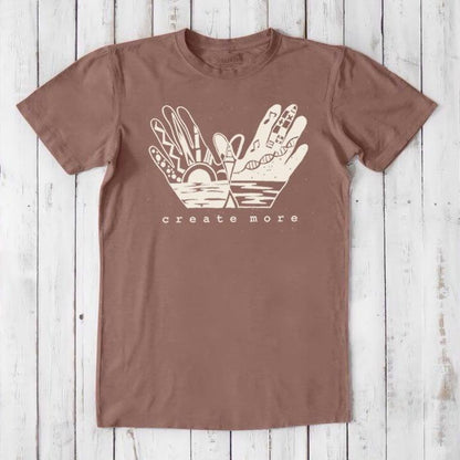 Brown Men's Hand Art T-Shirt in Bamboo & Organic Cotton with cream 'Create More' graphic. Eco-friendly apparel for artists.