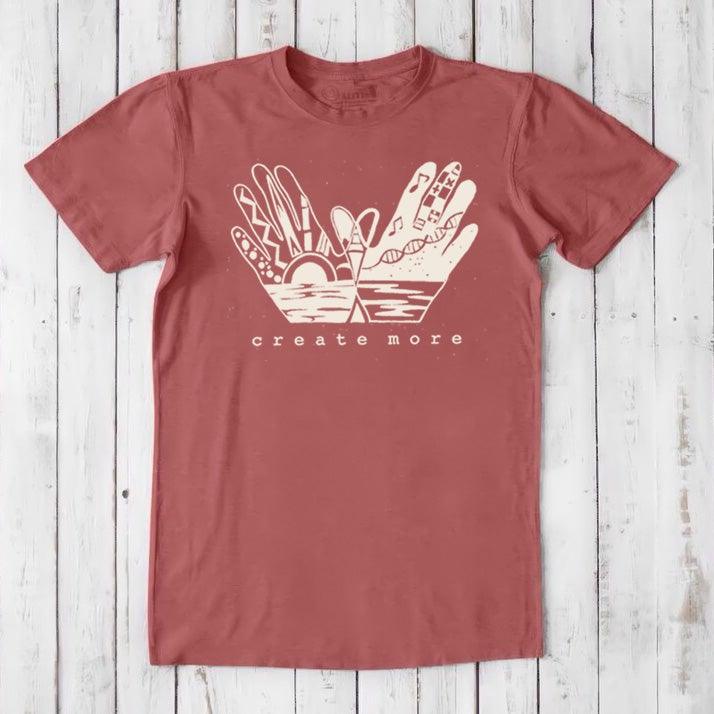 Brick red Men's Hand Art T-Shirt in Bamboo & Organic Cotton with cream 'Create More' artwork. Sustainable tee for creative expression.
