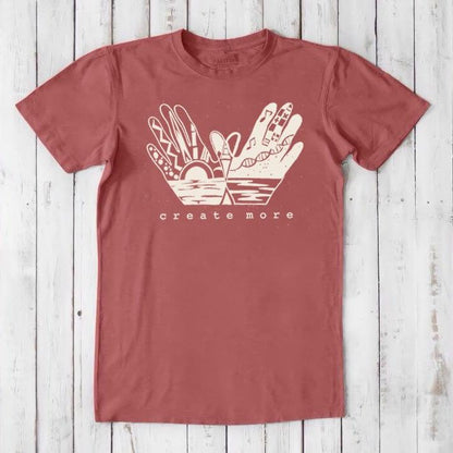 Brick red Men's Hand Art T-Shirt in Bamboo & Organic Cotton with cream 'Create More' artwork. Sustainable tee for creative expression.
