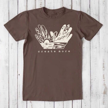 Dark brown Men's Hand Art T-Shirt in Bamboo & Organic Cotton with cream 'Create More' graphic. Classic fit for eco-conscious artists.