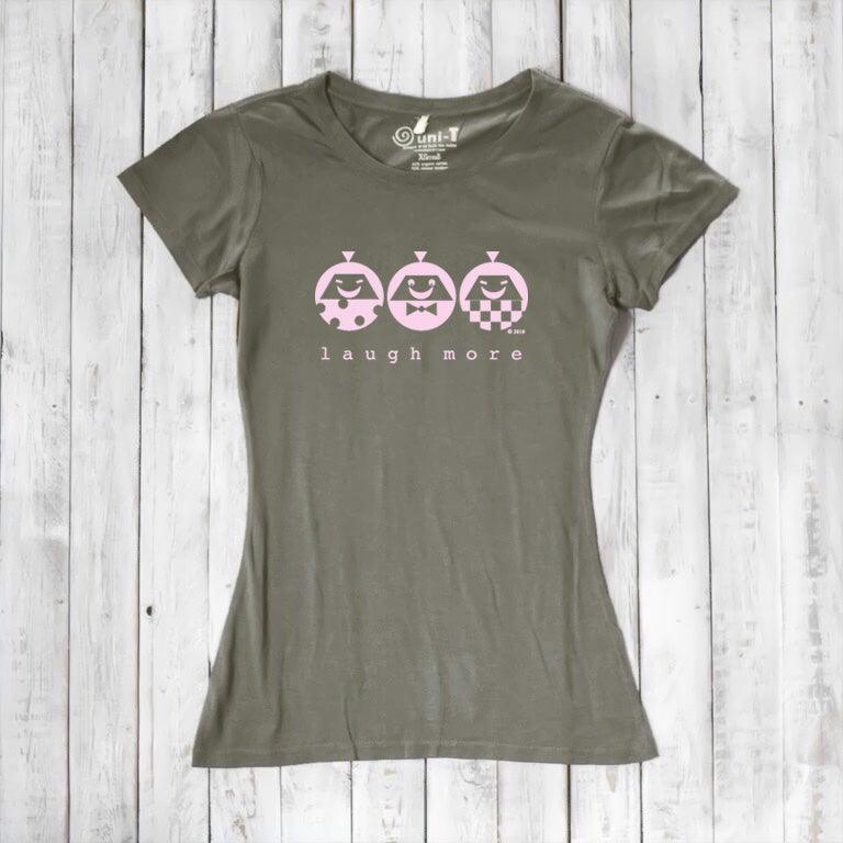 Olive green Women's Graphic Tee in Bamboo & Organic Cotton with pink 'Laugh More' print. Eco-friendly and cheerful gift idea.